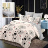 Ropa de cama gris y blanco con pequeñas corazones y semilunas