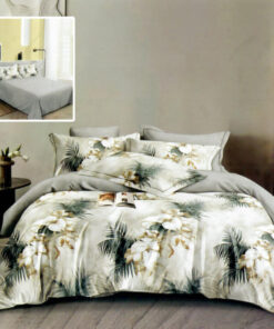 Ropa de cama gris y flores blancas