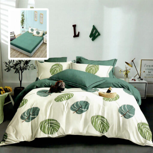 Ropa de cama blanca y verde con hojas verdes