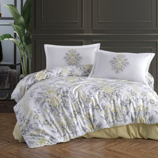 Ropa de cama blanca y amarilla