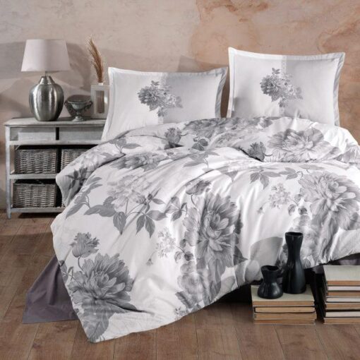 Ropa de cama blanca con flores gris