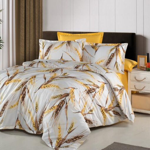 Ropa de cama blanca y amarilla con copos
