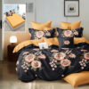 Ropa de cama negra y naranja con flores