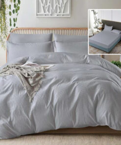 Ropa de cama gris con sabana bajera