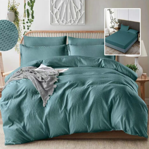 Ropa de cama turquesa con sabana bajera