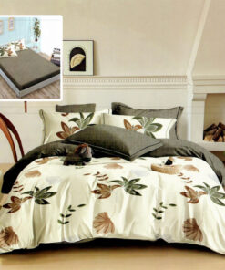 Ropa de cama blanca y gris oscuro con hojas