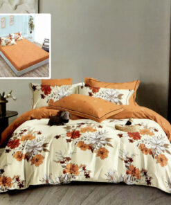 Ropa de cama naranja con flores blancas y naranjas