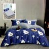 Ropa de cama azul y gris con flores blancas