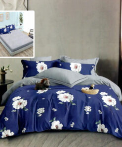 Ropa de cama azul y gris con flores blancas