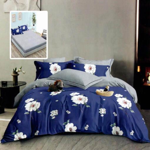 Ropa de cama azul y gris con flores blancas